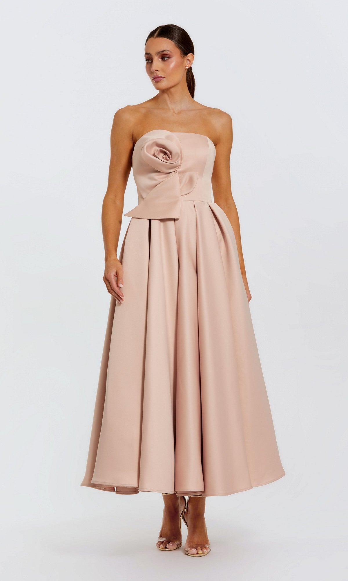 A woman wears the Mac Duggal 2330